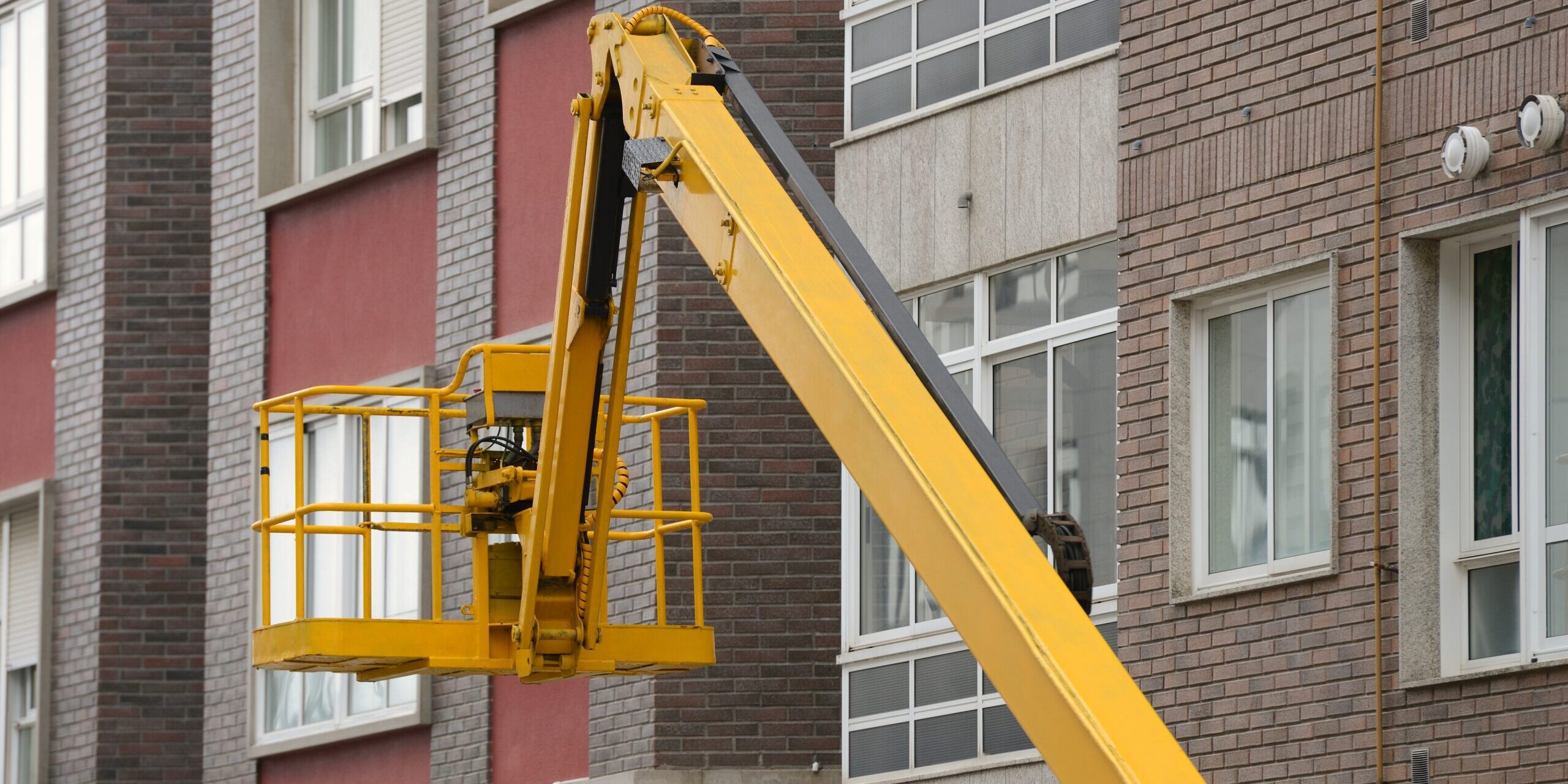 basket industrial lift in the background of the building
